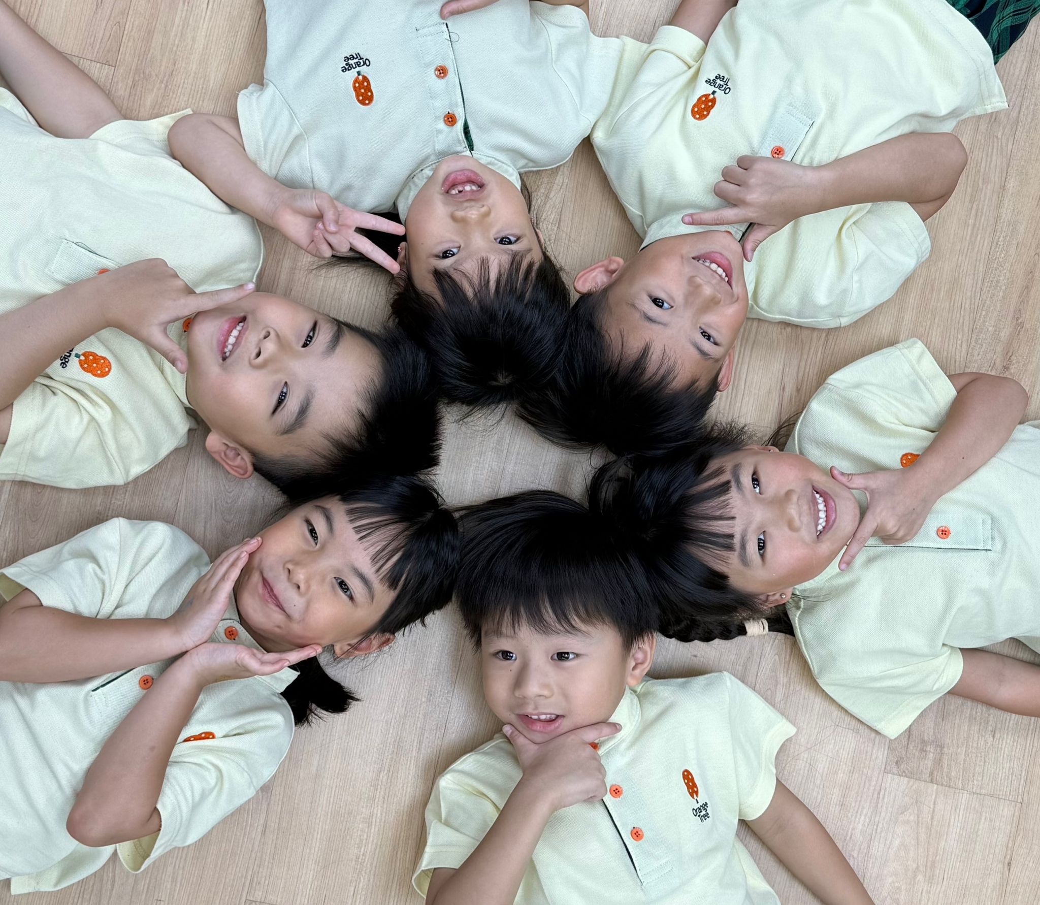 Children Lying Down on Floor