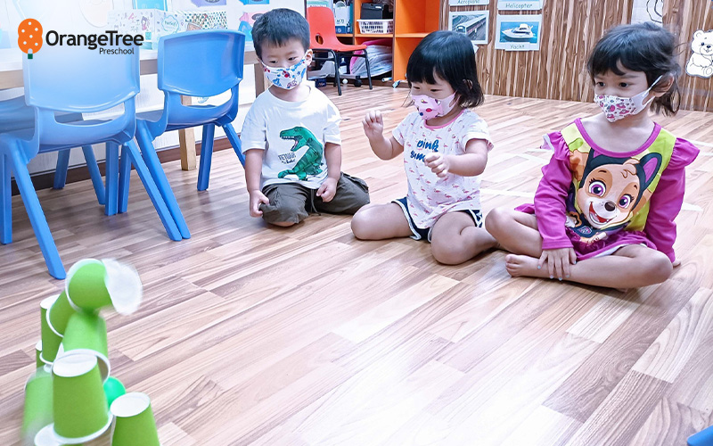 Children learning teamwork at OrangeTree Preschool.