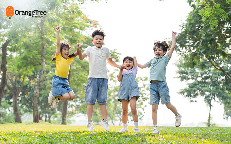 Happy_OrangeTree_Preschool_children_playing_outdoors_in_Singapore Happy OrangeTree Preschool children playing outdoors in Singapore.