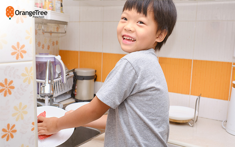 Young boy helping with household chores.