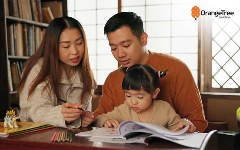 parents helping their child study