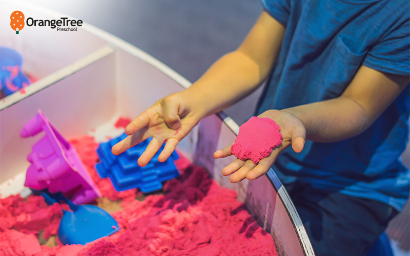 toddler developing fine motor skills through play
